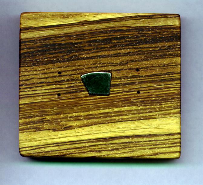Wood base with embedded magnet