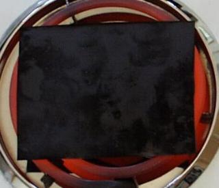 Black oxide on red burner